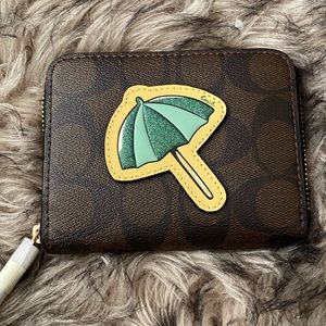 SMALL ZIP AROUND WALLET IN SIGNATURE CANVAS NWT